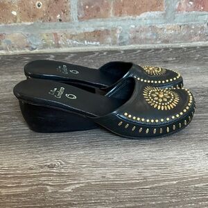 Calleen Cordero black leather and metal studded clogs